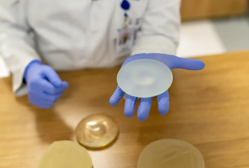 Clinician Holding Breast Implant Sample Case #12746 - Pancholi Cosmetic Surgery