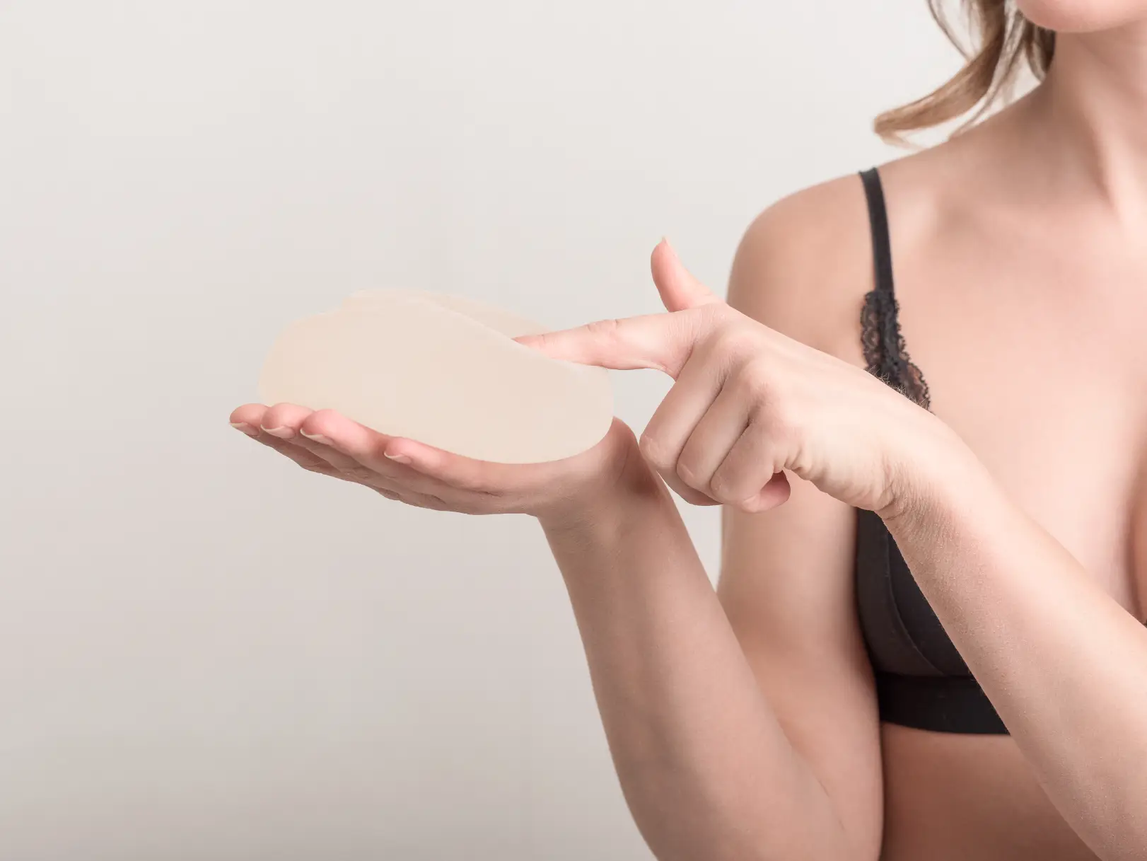 Holding A Silicone Breast Implant Case #12748 - Pancholi Cosmetic Surgery